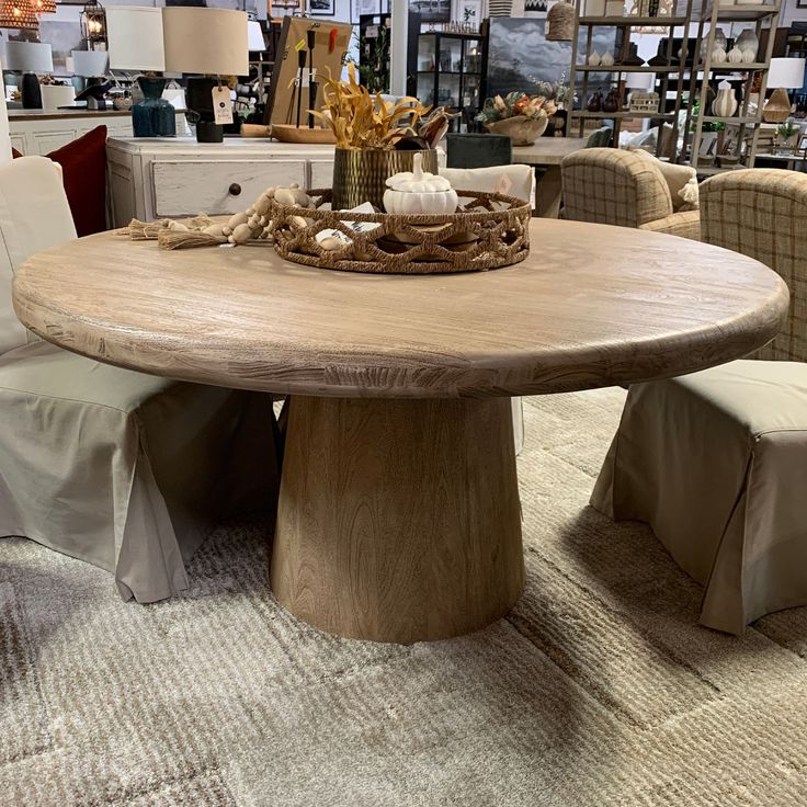 Striking in its simplicity, the Leila dining table is a natural beauty in solid Acacia wood. Dimensions: W: 60" D: 60" H: 30"Materials: Acacia WoodColors: Natural SandblastedTrove No. 40752 *All items final sale. Trove policies. Distressed Round Dining Table, 8 Person Round Dining Table, Large Round Dining Table For 8, Modern Coastal Dining Room, 60 Inch Round Dining Table, Dining Table Styling, Oak Kitchen Table, Rustic Round Dining Table, Dining Table Stone