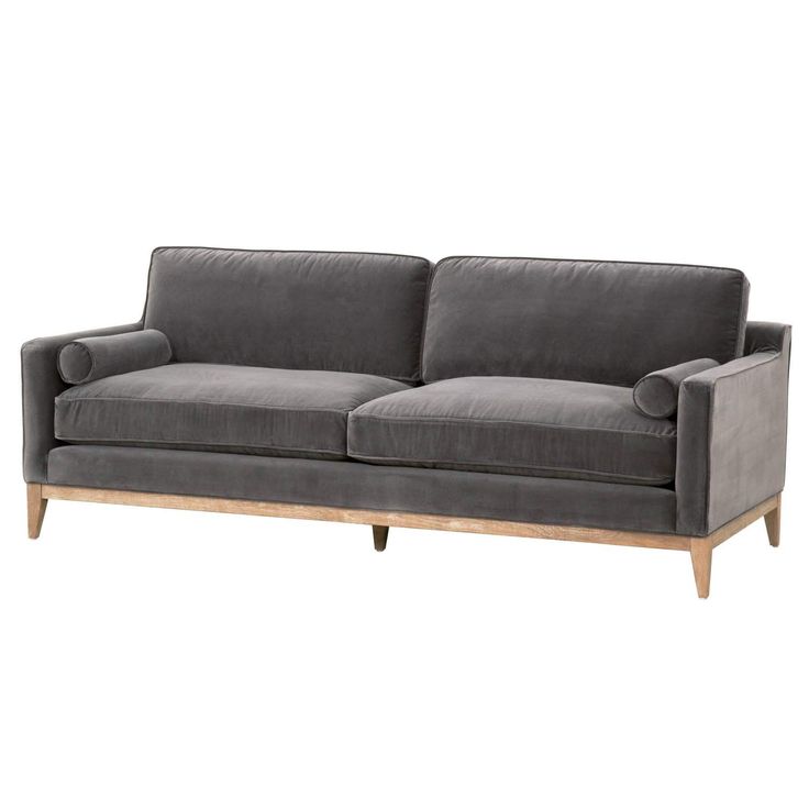 a gray couch with wooden legs on a white background