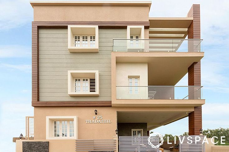 an apartment building with balconies on the second floor