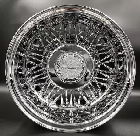 an image of a chrome plated wheel on a black background with the word's logo