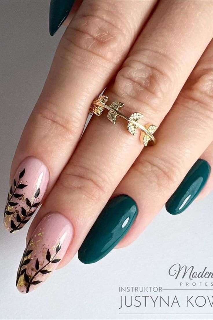 a woman's hand with green fingernails and gold leaves on the tip of her nails