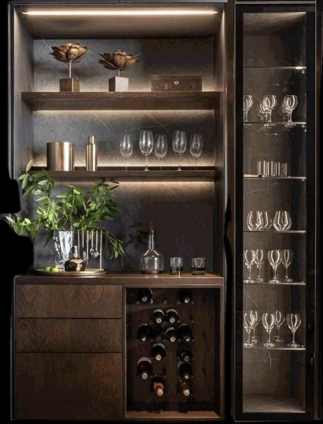 an open cabinet filled with wine glasses and bottles