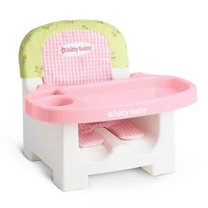 a child's plastic table and chair with pink tray on the top, white legs