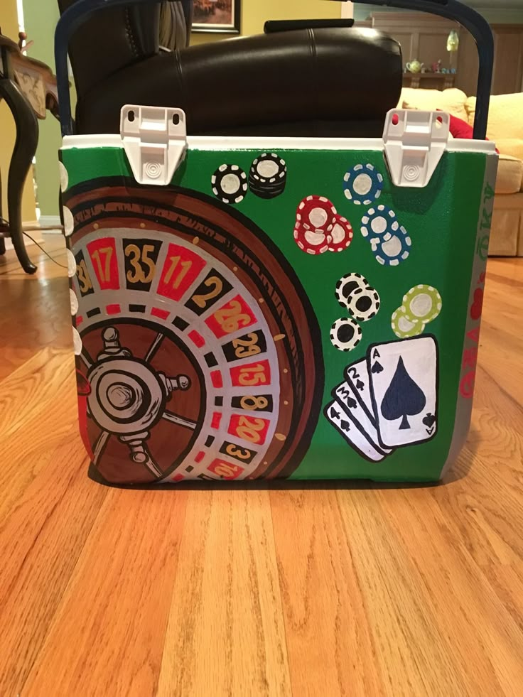 a green suitcase sitting on top of a hard wood floor