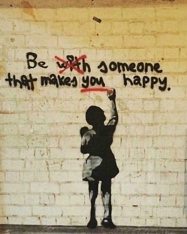 a painting on the side of a building that says be with someone that makes you happy