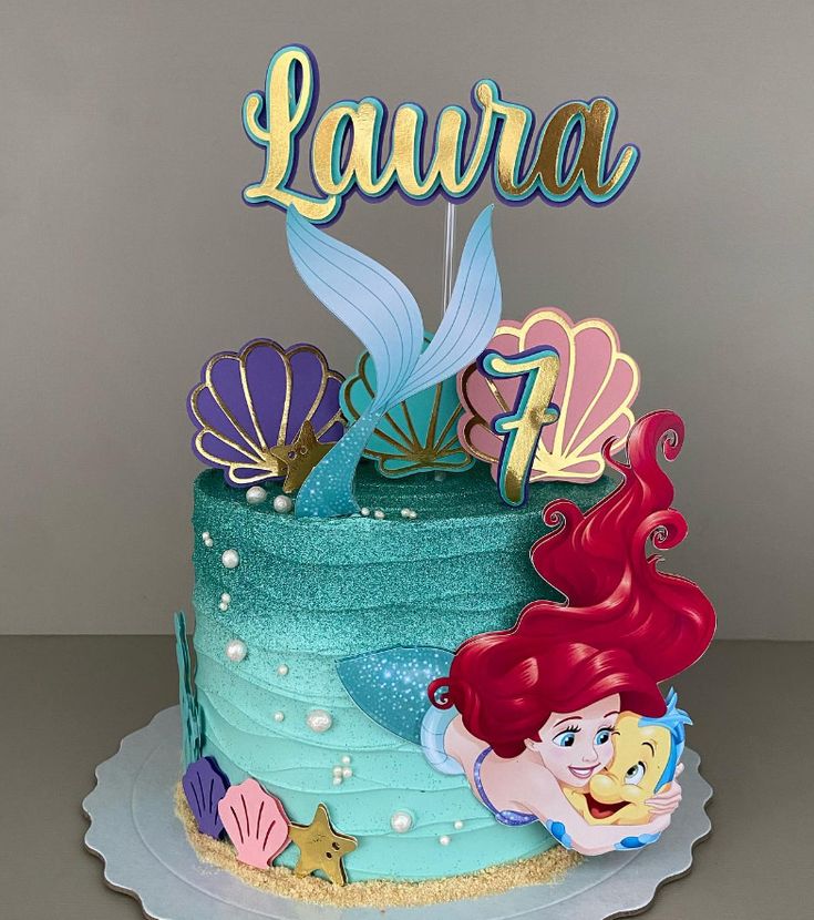 a little mermaid birthday cake with the name lavria on it's top