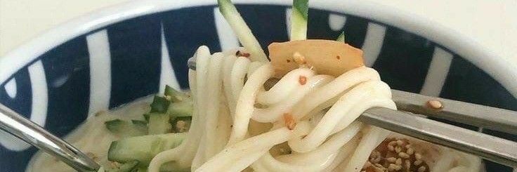 a close up of a bowl of food with noodles