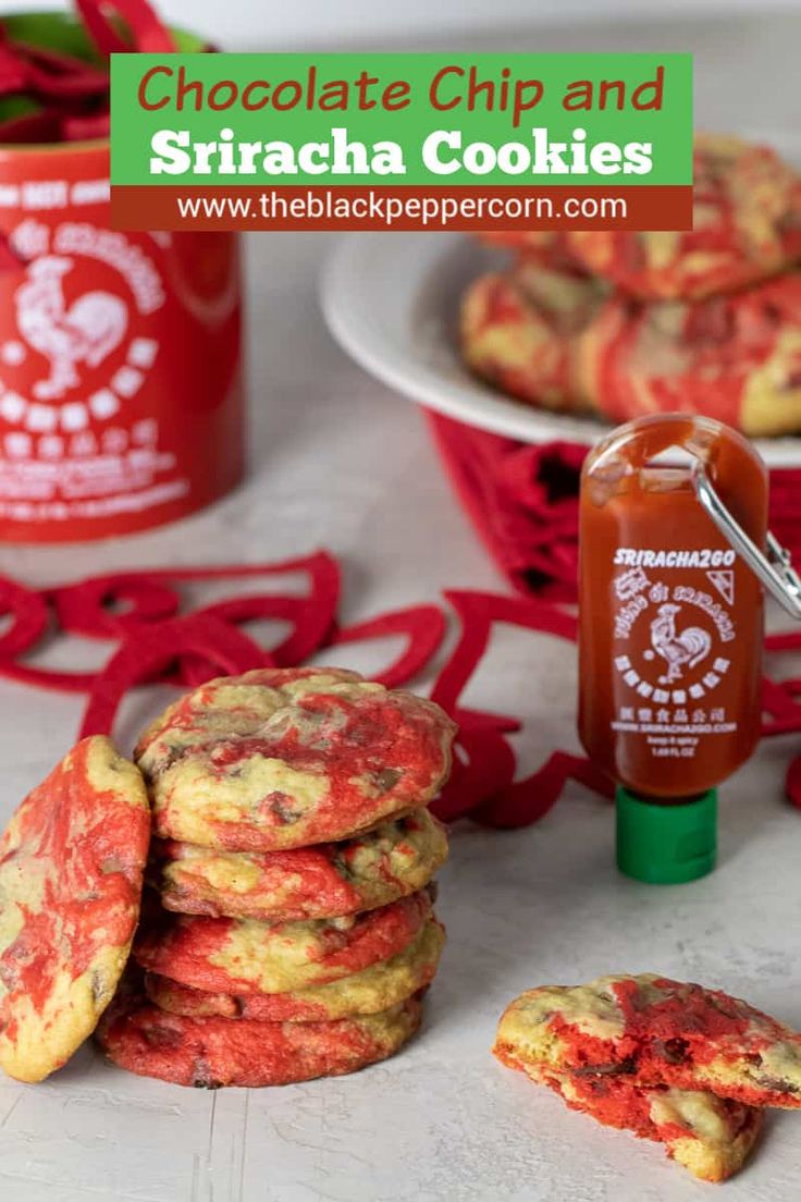 chocolate chip and sriraca cookies are stacked on top of each other next to a jar of ketchup