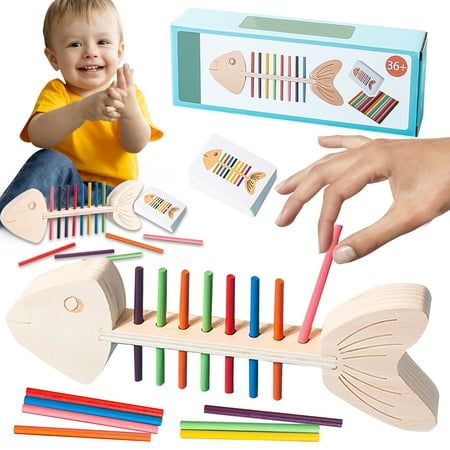 a child playing with wooden toys in front of an adult's hand and other items