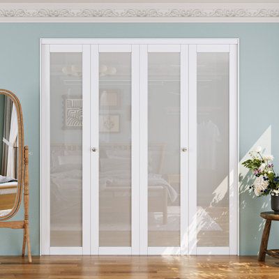 a room with blue walls and white doors