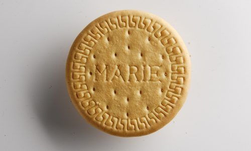 a close up of a cookie on a white surface