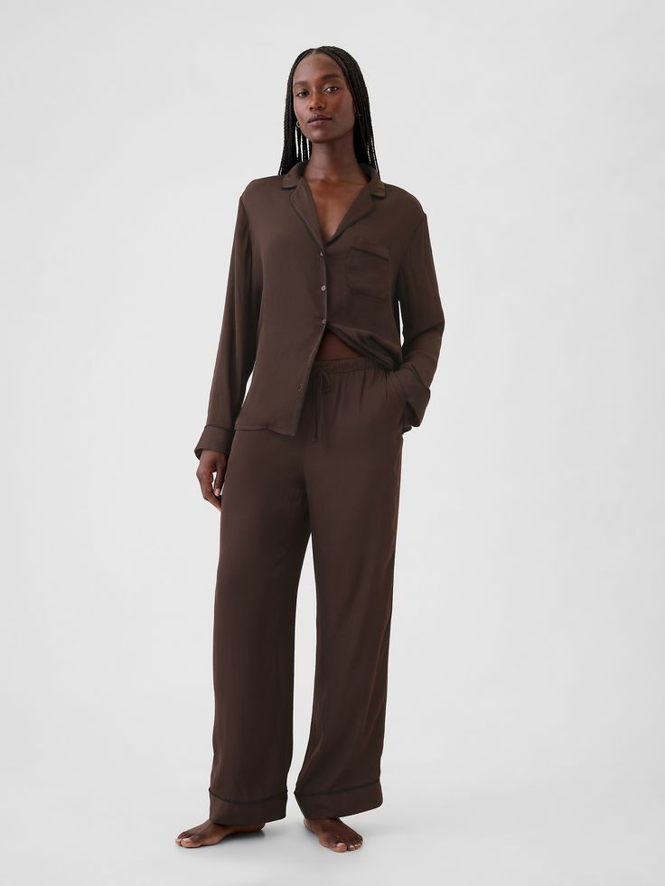 Soft satin pajama pants.  Elasticized waist with drawcords.  Front slant pockets.  Certain styles have allover prints.  Fit: Classic.  An easy silhouette that fits close  at the waist, and is relaxed through the hips and thigh.  Models wearing Gap Put Together Lounge Wear, Baggy Pjs, Brown Pajamas, Pjs Women, Satin Pajama Pants, Easy Silhouette, Womens Pjs, Deep Autumn, Satin Pajama