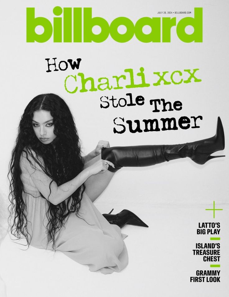 a woman sitting on top of a bed in front of a magazine cover with the title billboard