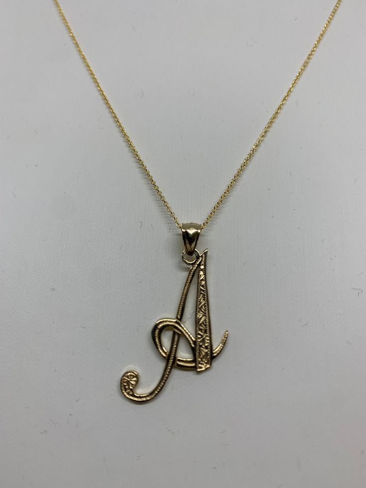 14k Solid gold cursive initial pendant  With or without chain  Choice of chain length These pendants are made with solid 14k gold. The pendants are diamond cut with solid loop marked 14k. Can be ordered with or without the fancy 14k gold rolo chain. The fancy rolo chains are known for their strength and beauty. Both the charms and chains are marked 14k for metal authenticity. Can be worn itself or layer it with other necklaces. Comes in a beautiful gift box. Initial Necklace Gold Letters Pendants, Gold C Necklace, Large Initial Necklace, Cursive Letter Necklace, A Necklace Initial, The M Jewelers, R Initial Necklace, Gold A Necklace, T Necklace Letter