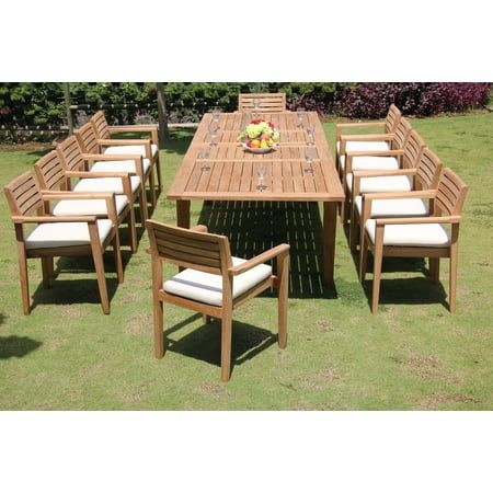 an outdoor dining table and chairs in the grass