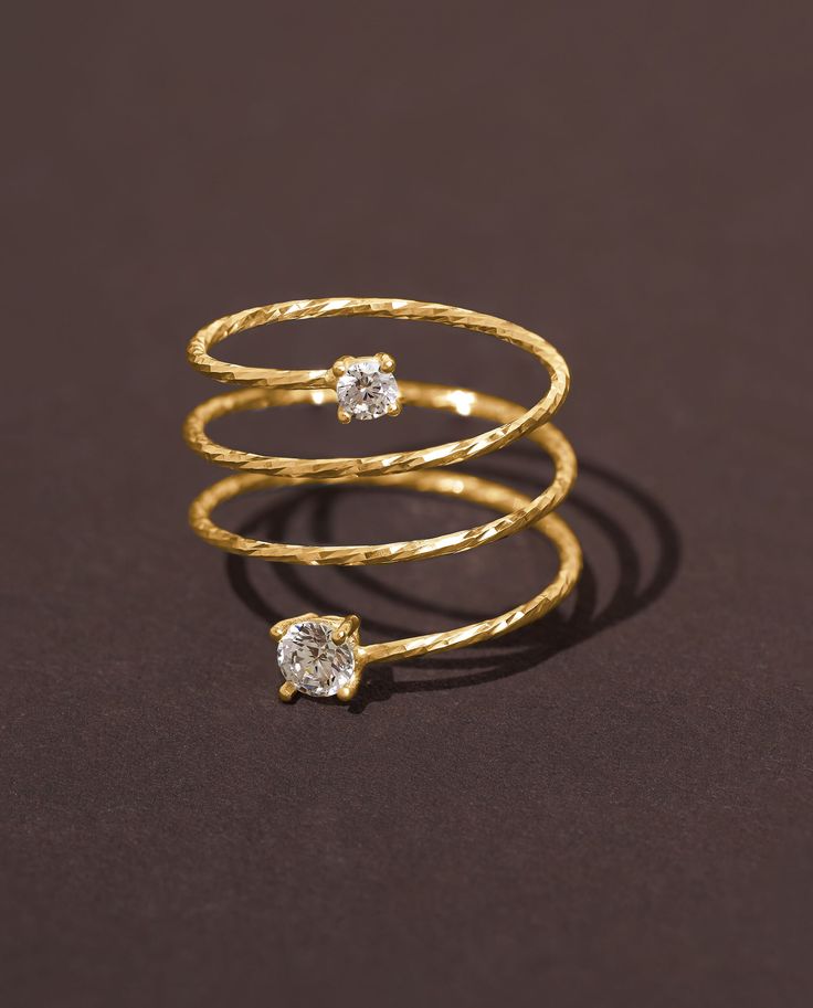 Introducing our exquisite Gold Wire Full Finger Ring, designed for those who appreciate statement jewelry. Crafted with precision, this Long Spiral Wire Ring in luxurious gold plating exudes elegance and sophistication. The unique spiral design gracefully wraps around your finger, adding a touch of glamour to your ensemble. Adorned with sparkling Cubic Zirconia accents, this 14K gold-plated ring truly stands out. Make a style statement and let your inner beauty shine with this one-of-a-kind and Sleek Ring Designs, Gold Ring Modern Design, Spiral Finger Rings Gold, Finger Rings Designs Gold, Spiral Rings Gold, Unique Gold Rings Modern, Pure Gold Rings For Women, Modern Gold Jewelry Unique Designs, Gold Finger Rings Unique