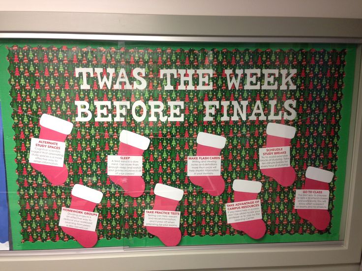 a bulletin board with christmas stockings on it and the words, twas the week before finals