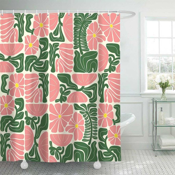 a shower curtain with pink flowers and green leaves on the outside, in front of a white bathtub