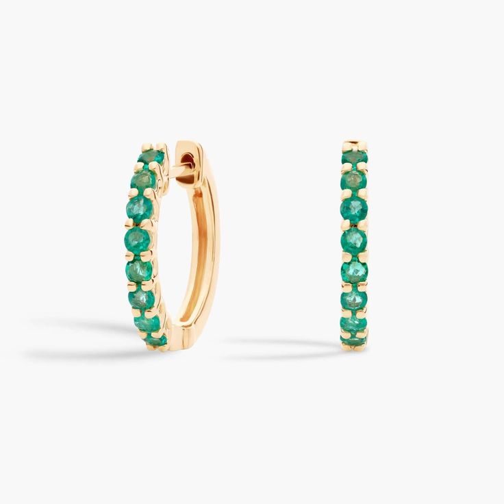 Go ahead, give your earring stack a pop of personality with these 14k yellow gold hoop earrings fronted by eight vibrant emeralds cut into delicate round shapes. Elegant Emerald Yellow Gold Hoop Earrings, Yellow Gold Emerald Hoop Earrings Fine Jewelry, Green 14k Gold Fine Jewelry Hoop Earrings, Green 14k Gold Hoop Earrings, Green Tarnish-resistant Gold-plated Hoop Earrings, Blue Nile, Gold Hoop, Precious Gemstones, Gold Hoop Earrings