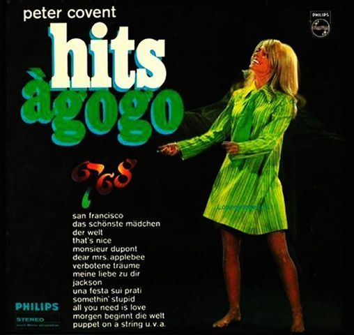 an advertisement for the album hits agoo, featuring a woman in a green dress