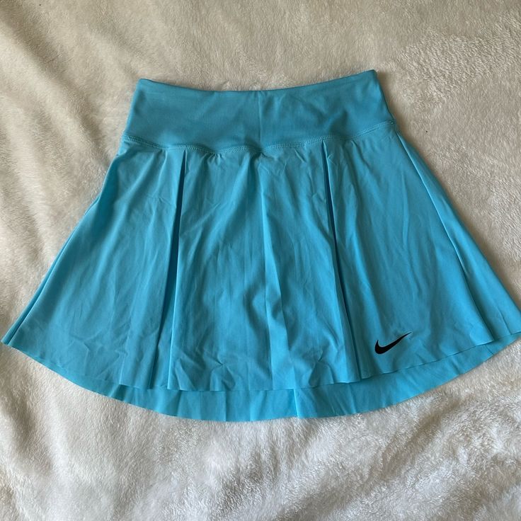 Never Worn Built In Shorts W/ Ball Pocket Color: Baltic Blue High Rise Blue Swim Skirt With Built-in Shorts, Blue Tennis Skirt With Short Inseam For Spring, Nike Skirted Bottoms For Summer, Blue Sports Skort With Elastic Waistband, Casual Blue Sports Skort, Blue Tennis Skirt For Summer Sports, Nike Fitted Tennis Skirt For Spring, Nike Pleated Skort For Spring, Nike Lined Skort For Spring