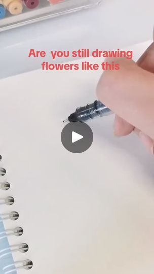 someone is writing on paper with markers and pencils in front of the page that says, are you still drawing flowers like this?