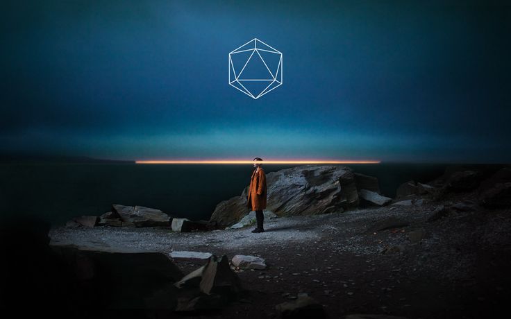 a man standing on top of a rocky hillside under a blue sky with an abstract geometric design