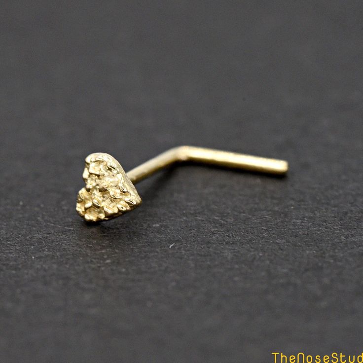 Solid 14k Yellow Gold 3mm Tiny 3mm Nugget Heart 14 Karat Yellow Gold Nose Stud Ring Screw End Metal: Solid 14K Yellow Gold Metal Stamp: 14K Finish: Polished Heart Size: 3mm Thickness: 0.6mm / 22 Gauge  Post Length: 7 mm Backing: Nose Screw Stud *Nickel FREE* It comes with a gift box. Ready for gifting Please read our shop policy before placing your order Thank you for visiting our shop Real Gold Nose Ring, Gold Nose Piercing, Nugget Jewelry, Gold Nugget Jewelry, Body Jewelry Diy, Custom Gold Jewelry, Xoxo Jewelry, Pandora Bracelet Designs, Gold Nose Ring