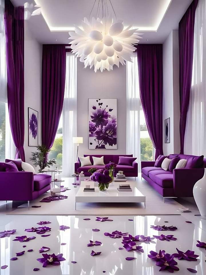 a living room filled with purple furniture and decor