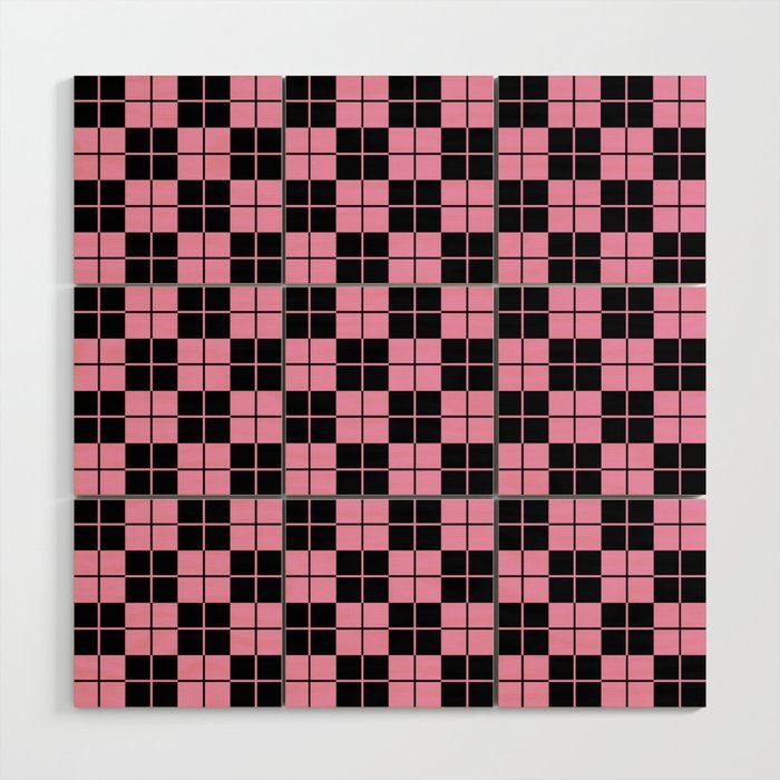 a pink and black checkered pattern on a white wall