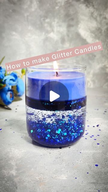 a blue candle sitting on top of a table