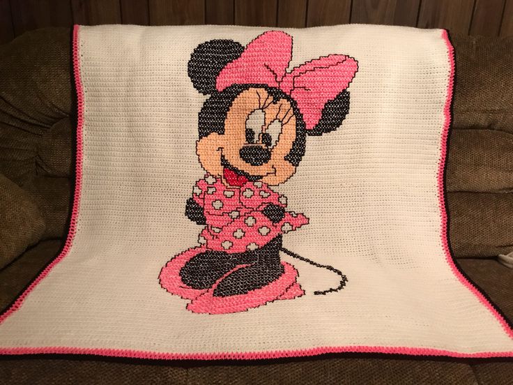 a crocheted minnie mouse pillow on a couch