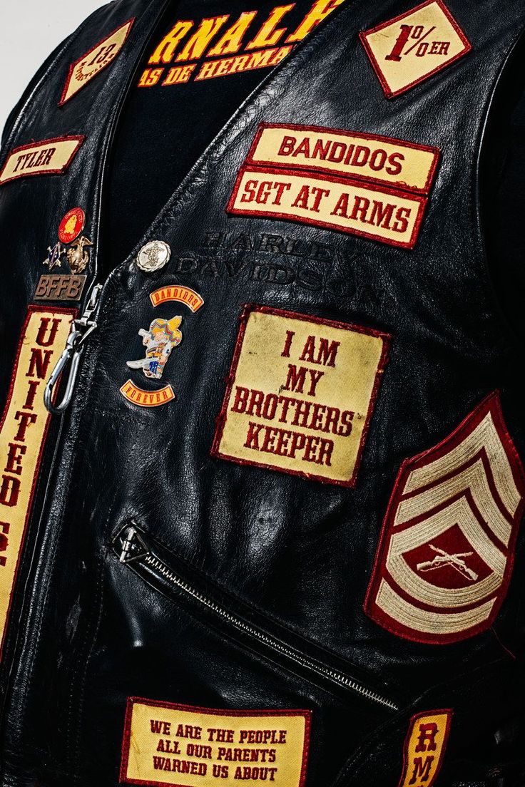 the back of a leather jacket with patches on it that say i am my brothers keeper