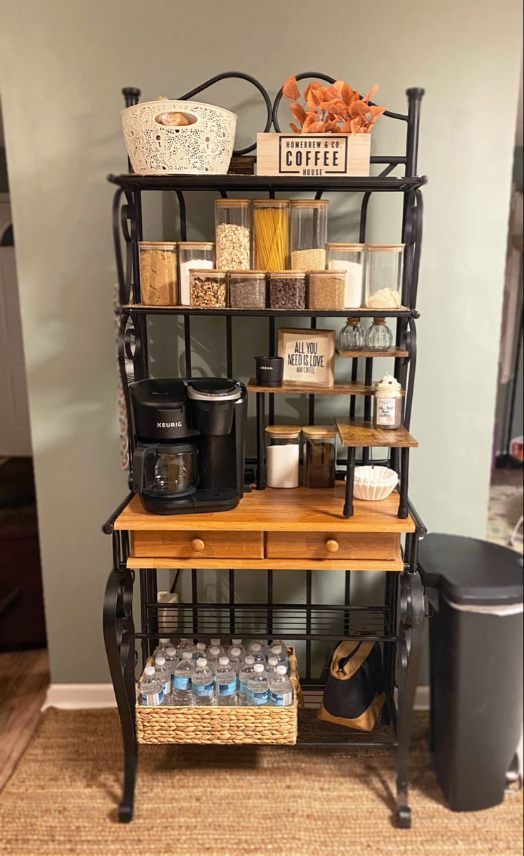 a shelf filled with lots of items on top of a carpeted floor next to a wall