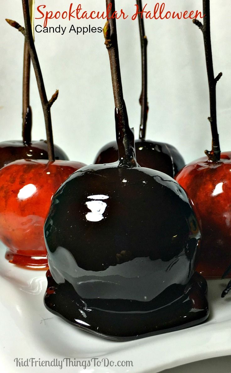 three chocolate covered cherries sitting on top of each other in front of the words spooked out halloween candy apples