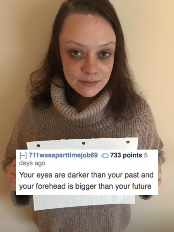 a woman holding up a sign that says, your eyes are darker than your past and your forehead is bigger than your future