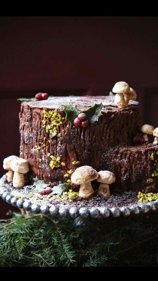 a cake with mushrooms on it sitting on top of a table