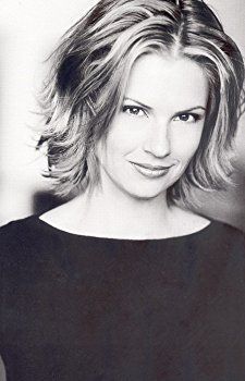 a black and white photo of a woman with blonde hair