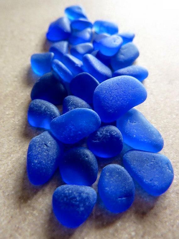 blue glass pebbles laid out on the floor