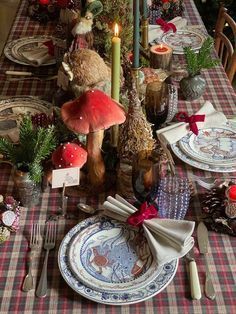 the table is set for christmas dinner