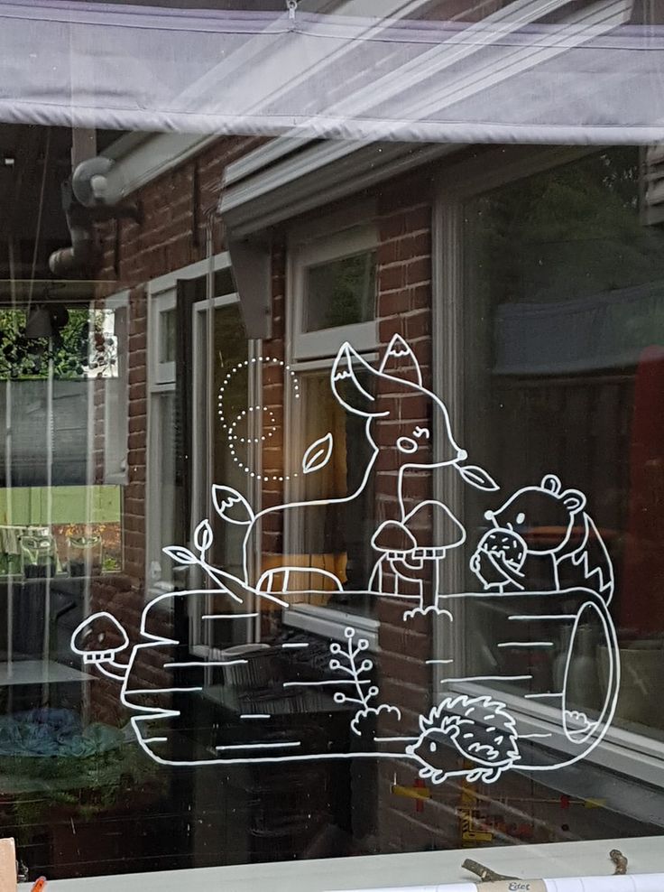 a window with some drawings on it