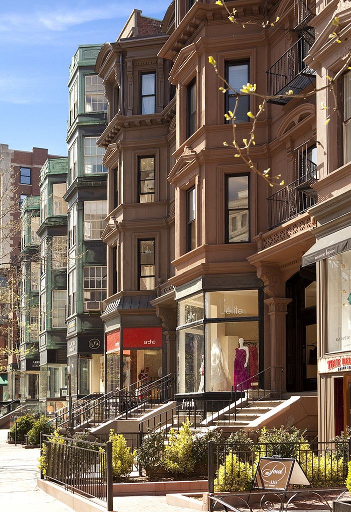 a row of buildings on a city street