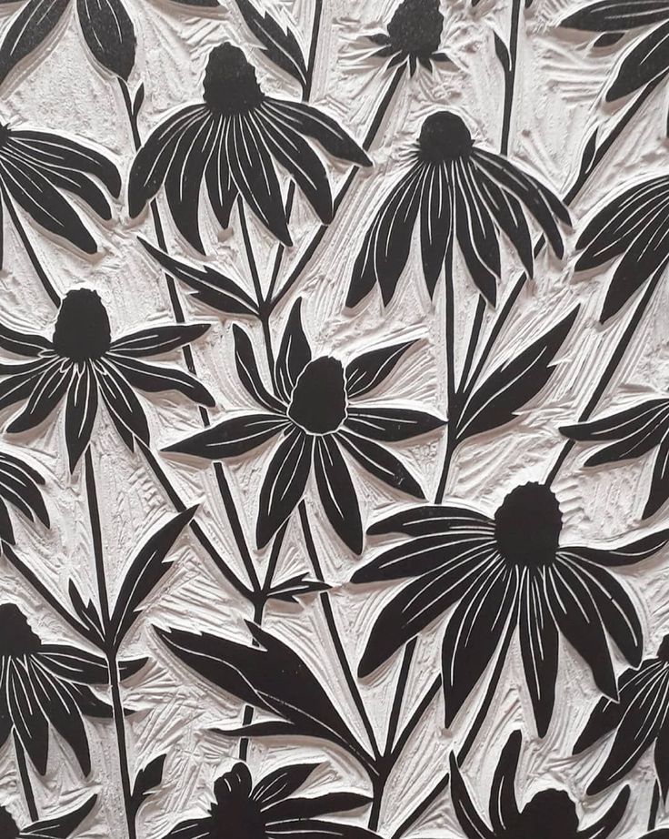 an image of black and white flowers on paper