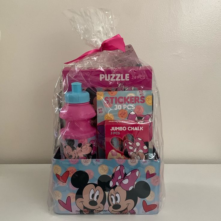 a plastic bag with mickey mouse items in it