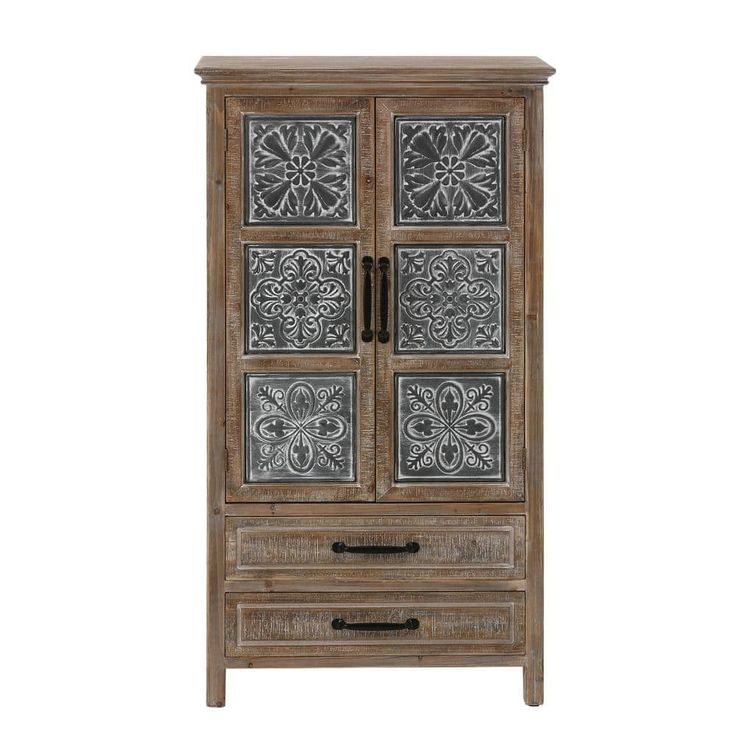 an old wooden cabinet with metal panels on the door and drawers inlayed to it