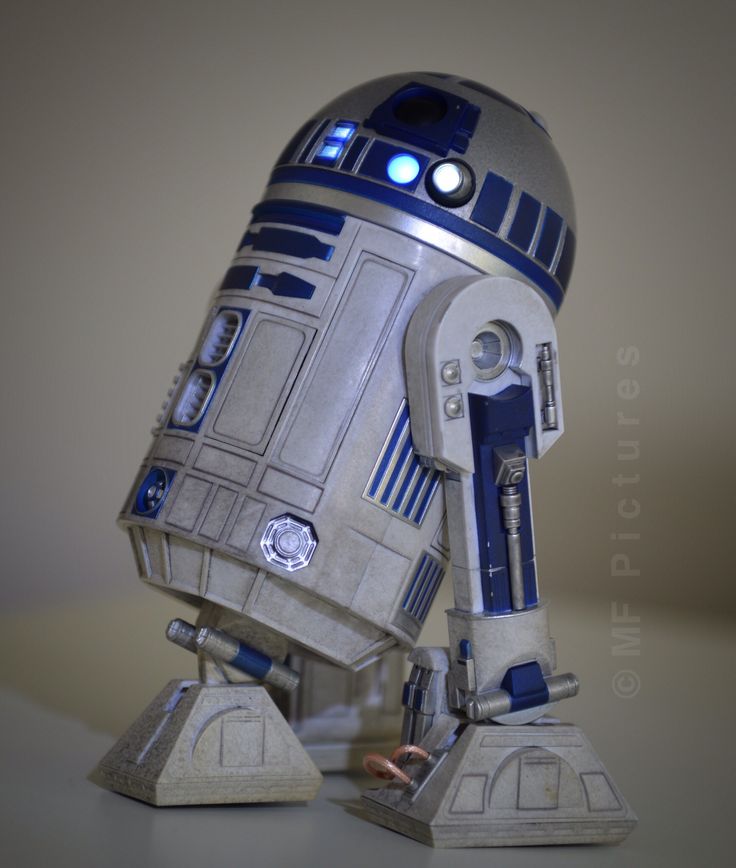 a star wars r2d2 paper model on a table with the lights on