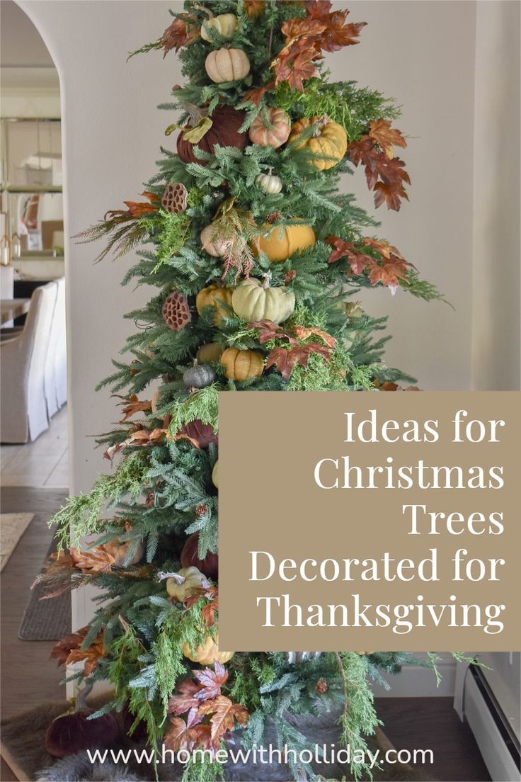 a christmas tree decorated for thanksgiving with pumpkins and greenery on top, in front of a fireplace