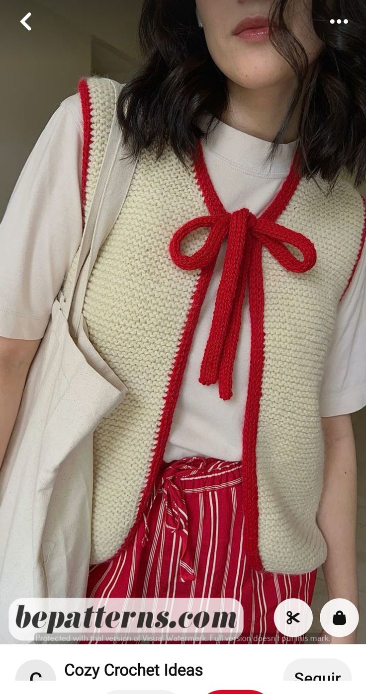 a woman with black hair wearing a white shirt and red skirt