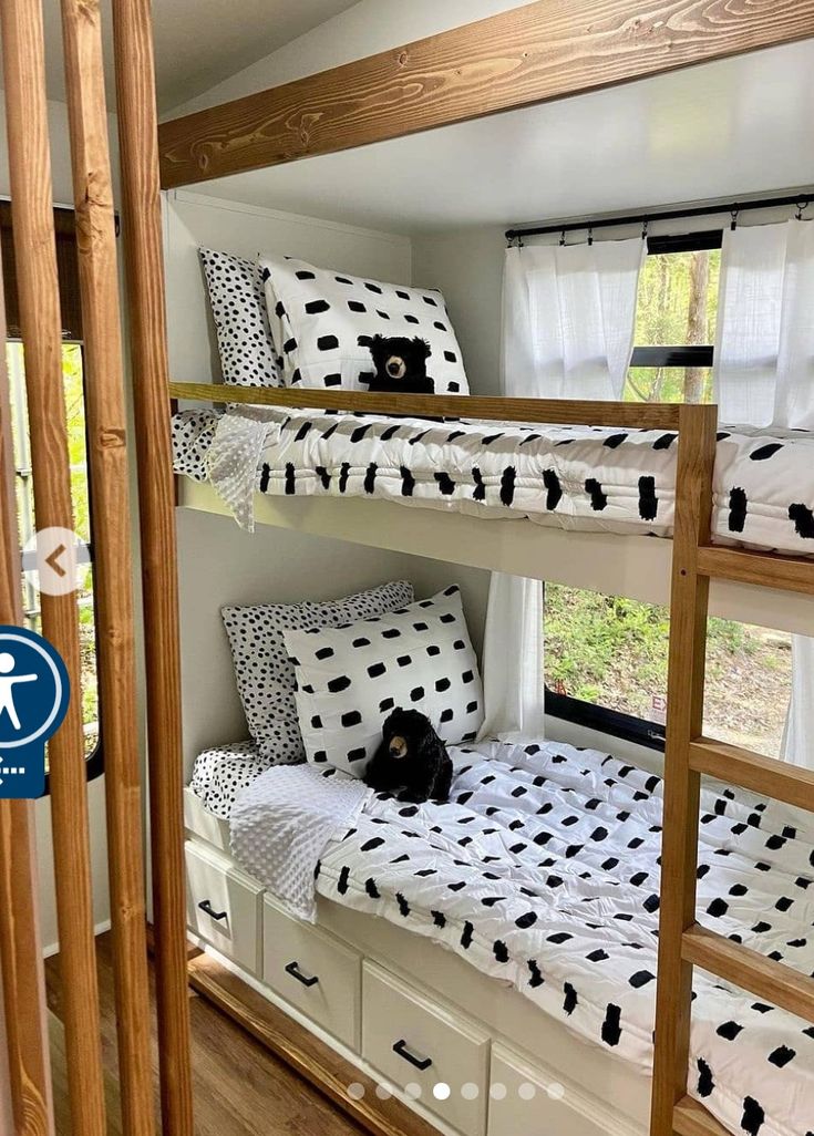 the bunk beds are decorated with black and white polka dots