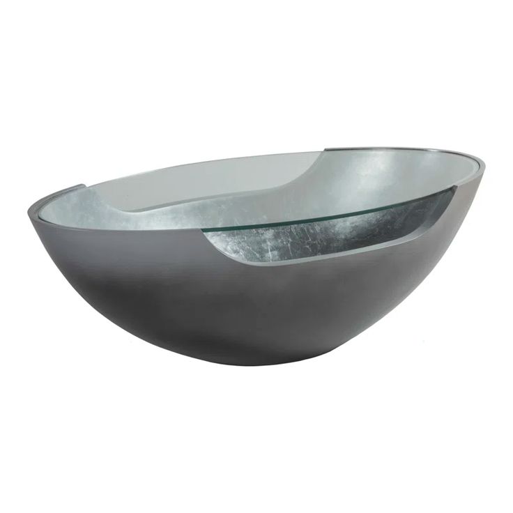 a silver bowl with a curved design on it